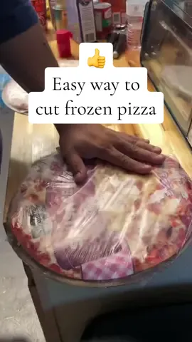 Kitchen hack! If you don’t want to cook an entire frozen pizza at one time, here’s a simple pizza hack to help cut it while it’s still frozen. 🍕 video credit: @Mr. Cilantros seasoning #kitchenhacksandtips #foodiehacks #pizzahacks #cookingtipsforbeginners #everythingfoodhack 