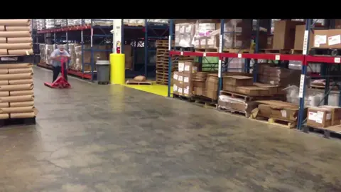 Worker Riding Pallet Jack Slides in Style on Reaching Destination #work #cool #impressive #trick #ride #amazing #slide #talent #skill #indoor #workplace #funnyvideos #fyp #foryou #trending #viral