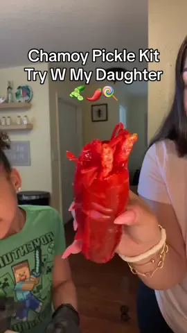 My daughter has been dying to try this viral chamoy pickle kit 🥒🍭🌶️ #chamoypickle #chamoypicklekit #chamoypicklefruitrollups #fyp 