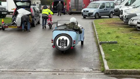 In this video we see Tim Penn and his 1939 Morgan F-type three wheeler (1172cc four cylinder engine).  Location is Ardingly Classic Bike Show and Jumble, Ardingly Showground, West Sussex, UK. Thanks to Julie Diplock and the team at Elk Promotions for having us along there on the day. Video by Alex Rollings. Instagram: @motofilmer If you’d like to have your bike featured on our account, collaborations or for business enquiries with The Classic Motorcycle Channel please DM us direct. All our photo and video content is original work and copyright to The Classic Motorcycle Channel. We DO NOT give you permission to copy our work for any purpose. #morganftype #morgancars #classiccars #classicmotorcycles #threewheeler