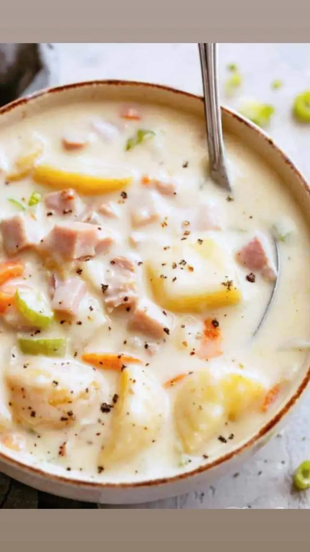 Homemade comfort shines in this Creamy Ham and Potato Soup. A delightful blend of ham, potatoes, and creamy goodness for a soul-warming meal. Ingredients:  • 2 tablespoons olive oil  • 1 medium onion, chopped  • 2 stalks celery, chopped  • 1 carrot, sliced into thin rounds  • 3 cups Yukon Gold potatoes, chopped in large bite-size pieces (with jackets on)  • 1/2 lb sweet deli ham, cut into strips  • 2 cloves garlic, minced  • 1/2 teaspoon onion powder  • 2 teaspoons dried parsley  • 3 cups low-sodium chicken broth  • 3 tablespoons butter  • 3 tablespoons flour  • 1 cup milk  • Salt and pepper Instructions:  1. In a large stockpot, heat olive oil over medium heat. Add onion, celery, carrot, red potatoes, and deli ham. Sauté until the onions and ham start to crisp on the edges, approximately 5-7 minutes. Add garlic, onion powder, and parsley; cook for an additional 1 minute.   2. Stir in the low-sodium chicken broth. Bring the mixture to a boil, then reduce heat and simmer until the potatoes are tender, approximately 15 minutes.   3. In a skillet, melt butter and whisk in flour. Whisk over low heat for 3-4 minutes. Slowly whisk in the milk to create a creamy consistency and remove any lumps. Once thoroughly mixed and thickened, slowly whisk or stir the mixture into the soup. Simmer until warm and season with salt and pepper to taste. Notes:  • Deli-style ham adds a slight crispness and extra texture, but you can use a ham bone, leftover ham, or smoked ham steak.   • Opt for Yukon Gold or red potatoes for the best results. They are less starchy than russets and hold up well in the soup.   • Garnish the soup with chives, green onions, sour cream, or cheddar cheese.   • Store leftovers in an airtight container in the refrigerator for up to 3 days. Reheat with caution to avoid overcooking the potatoes.   • For freezing, fully cool the soup before ladling it into freezer bags. Leave space at the top for expansion, remove excess air, and freeze in a single layer for efficiency. #granskitchengarland #FoodFamilyFellowship #garlandfoodie #dallasblackfoodies #blackownedbusiness #soupseason  #soup #recipesoftiktok  #potatosouprecipe  #ham #holidayfood  #fallfood  #hellofall 