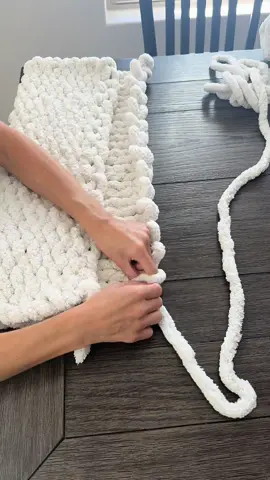 Baby blankets are so fun to make because they don’t take too long. I make mine with three skins of yarn, but you can always make them smaller. #fingerknitting #fyp #chunkyblankettutorial #handknitblanket #falldecor #handknit #diyhomedecor #etsycreatorco #chenilleblanket #armknitting #diycrafts 