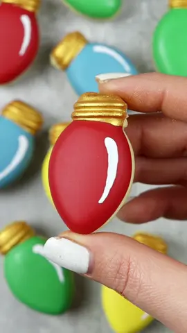 Light Bulb Chocolate Chip Cookies 💡🎄  Fill cavities two thirds of the way up with cookie dough and bake for 12-15 minutes on 350/160C fan or until slightly golden. Cool completely, and freeze for 10 minutes. Unmold. wash and dry mold and fill the bases with multicoloured Chocolate. Add cookies back on top. Set in the freezer for 15 minutes. Decorate with edible paint. I've linked the most similar mold I could find in my amazon storefront - link in bio. #chocolatechipcookies #christmascookies #lightbulb #holidaybaking 