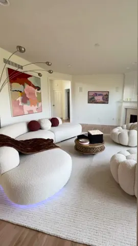 Utterly Obsessed! 😍 We absolutely love 💕 getting photos from happy customers, especially when we get to see makeovers that look this incredible!!  The modern curved Bjorn sofa and Mello swivel chairs look stunning in her neutral contemporary living room seen here. The pop of color via the Palla round pillows and cozy faux fur throw blanket add a beautiful warm touch.  #alchemyfinehome #livingroomdecor #livingroommakeover #livingroomideas #curvedsofa #whiteinterior #whiteinteriors #neutraldecor #modernhomedecor 