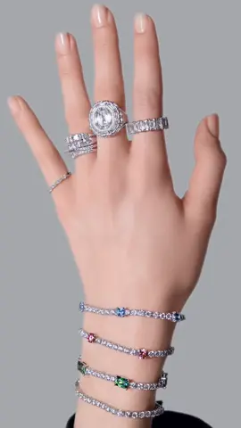 Channel the spirit of maximalism and pair statement cocktail rings with multiple bracelets — round stones and square cut crystals diffuse the light beautifully for a look that commands attention. #Swarovski #CelebrateWonder #CrystalMetamorphosis
