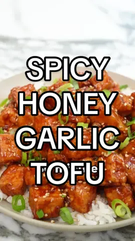 Spicy Honey Garlic Tofu is the perfect easy 30 minute meal! The crispy tofu is tossed in a sweet and spicy garlic honey glaze and absolutely delicious with a bowl of freshly steamed rice! Find the full recipe with all my key tips on the blog. Enjoy! #EasyRecipes #cookingvideo #asianfood #tofu #cjeatsrecipes #dinner #flavrs