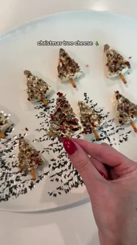 Christmas tree cheese bites!🎄 I make these every year - so fun, EASY & festive! And delicious of course 😋 Just take laughing cow cheese wedges & dip them in a spice mixture (I used an Italian blend + red pepper flakes) Add a pretzel stick for tree trunk & that’s it!  #holidayhosting #holidaysnacks #holidayrecipe #seasonalrecipes #christmasrecipe #snackideas 
