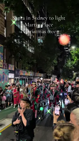 Santa in Sydney to light Martin Place Christmas tree. Lord Mayor Clover Moore joined by Santa tonight, to officially light the 24m Christmas tree in Martin Place under a glittering fireworks display, following a sleigh ride from Circular Quay with a marching band and elves on reindeer tricycles.#australia #visitnsw #sydney #martinplacesydney #christmastree#christmas #fireworks #jessjamesjo 