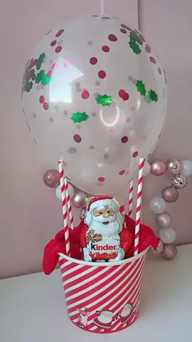 DIY budget gift idea. Santa hot air balloon gift. I mean look at it who wouldn't want to receive this 😍🥰🎅🎁 I absolutely love this perfect for children and adults and cheap to do too Buckets are 50p each (£1 for 2) Balloon 20p ( £1 for 5) Straws 16p (£1 for 25) all from @Poundland  Plus add chocolates of your choice  £2 for two tubes of chocolate Kinder Santa mine is the 110g one roughly. £2 Sellotape your straws inside the bucket. To attach the balloon to the top of the straws I stuck on double sided tape to the top of each straw. #homemadechristmas #christmasgiftsideas #christmasonabudget #homemadegifts #giftideas #stockingfillers #mumhacks #diychristmasgifts #diychristmas #secretsanta #secretsantagift #teachergifts #teachergift #budgetfriendlygifts #budgetfriendly #giftsforchildren 
