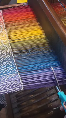 Finally cutting this off of my loom! #rainbowwarp  #weaving  #floorloom  #fofriday  #reclaimedyarn  #upcycled  #upcycledyarn  #handmade  #handwovwen  #handmadegifts 