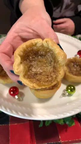 Butter Tarts - A Canadian Classic! Ingredients: 1 box Pillsbury pie crust 1 cup brown sugar 1/2 cup light or golden corn syrup  1/2 cup melted butter 2 large eggs 1-1/2 teaspoons vanilla extract  1/4 teaspoon salt 2 teaspoons white distilled vinegar  #queengsrecipes #buttertart #dessert #yummy #delicious #baking #easy #EasyRecipe #edit #fyp #explorepage #xyzbca #xybca #holiday 
