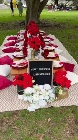 Embracing the holiday spirit with a picturesque Christmas picnic by the beach!   Our color palette dances in festive hues of red, white, and a subtle touch of gold, creating an enchanting setup that mirrors the magic of the season.  The table is a masterpiece adorned with velvety red candles casting a warm glow, delicate reindeer figures adding a whimsical touch, and the regal Poinsettia flowers standing tall as the quintessential symbol of Christmas joy.  #ChristmasMagic #BeachPicnic #FestiveCelebration #picnicsetup #picnic #celebration #christmas #christmaspicnic #sydney #picnic 