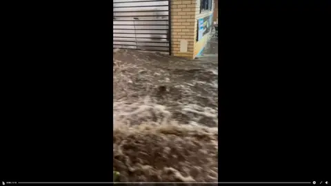 Incredible scenes are unfolding in Queensland's Far North, which is grappling with the impacts of ex-Tropical Cyclone Jasper. This footage was taken at Ellis Beach Surf Lifesaving Club, just north of Cairns. Latest emergency/flooding alerts via link in bio
