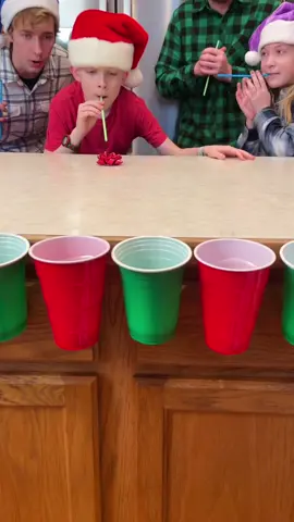 Blow the Bow in the Cup!!🎁🎄 #fyp #games #familygamenight #christmas #christmasparty #partygames #familygathering 