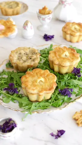 Chicken quiche with leek and mushroom  Guess what's cooking in my kitchen this Christmas Eve? These adorable mini quiches with lids, made extra special using my @Decora tart molds. The taste? Absolutely fantastic – hubby even rated them a solid 10/10!  Ingredients  For the shortcrust pastry: •2 ½ cups all-purpose flour •1 tsp salt •1 stick cold unsalted butter, cut into pieces •½ cup vegetable shortening chilled and cut into pieces  •½ cup to ¾ cup cold water For the filling  •1.3lbs chicken breast, cut into small cubes •9oz mushrooms  •2 Leeks, sliced into rounds  •2 cups chicken stock, or as needed •1/2 cup heavy cream •2 tbsp flour •2 tbsp butter  •1/4 cup mozzarella cheese  •Good pinch of Nutmeg  •Salt & Black Pepper, to taste •1 Egg For the shortcrust pastry: 1.Stir together flour and salt in a large bowl. 2.Add butter and shortening, coat with flour; flatten into pea-sized pieces. 3.Sprinkle ½ cup cold water. 4.Add water by the tablespoonful as needed until the dough holds together. 5.Divide into two disks, wrap in plastic; chill for at least two hours or preferably overnight. For the chicken and mushroom filling: 1.Fry chicken until golden, then set aside. 2.Melt butter, add leeks, fry briefly, then add mushrooms and fry until colored. 3.Stir in stock, add back chicken, pour in cream, add nutmeg and cheese. 4.Simmer until thickened, stirring occasionally to marry flavors and reduce sauce. 5.Roll out shortcrust pastry into a ⅓ inch high sheet on a floured surface. 6.Cut out 16 circles, use half to line tart tins, reserve remaining circles for optional lids. 7.Make lids using tart mold as a cutter; create handle with parchment paper covered by dough. 8.Pour 2-3 tablespoons of mixture into each pie. 9.Brush pies with an egg wash. 10.Bake in a preheated oven at 190°C for about 30-40 minutes until golden on top.