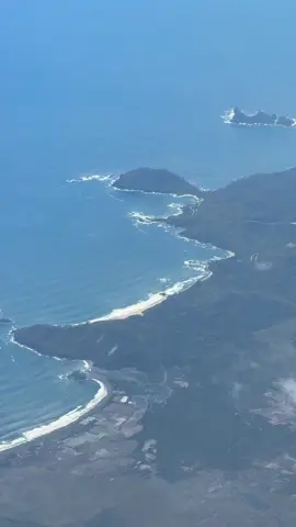 An aerial view of the Tujuh Bukit mining operation in East Java province of Indonesia. A giant unexploited porphyry copper deposit lies beneath the current shallow open cut workings. 