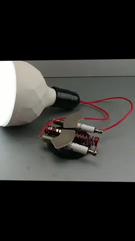 Electric Science Free Energy Using Copper Wire And Spark Plug With 220v Light Bulb At Home.  #mechanic #mechanical #mechaniclife #foryou #yfp #machanic #machanical #machaniclife #energy #freeenergy 