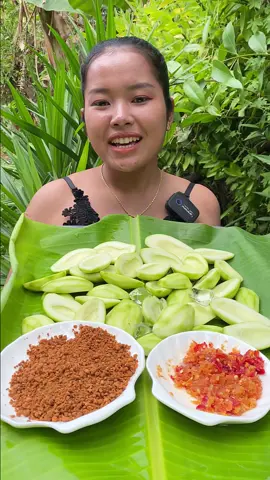 Eating mango with spicy salt, so yummy