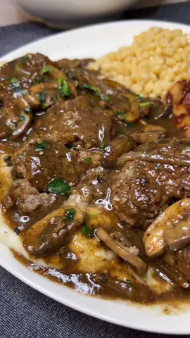 Homemade Salisbury Steak Recipe! This Easy Homemade Salisbury Steak recipe is a timeless classic that brings comfort and fond memories to the dinner table. The recipe features juicy ground beef patties smothered in a rich mushroom and onion gravy. Seriously, this comfort food dish is like a hug on a plate! It’s easy to make, and perfect for any meal. For sure, this nostalgic recipe will quickly become a family dinner favorite. Also, be sure to check out my unique way to use leftovers! #salisburysteak #comfortfood #tvdinner #DinnerIdeas #leftovertransformation #leftoversrecipes #groundbeef #cookingtutorial 