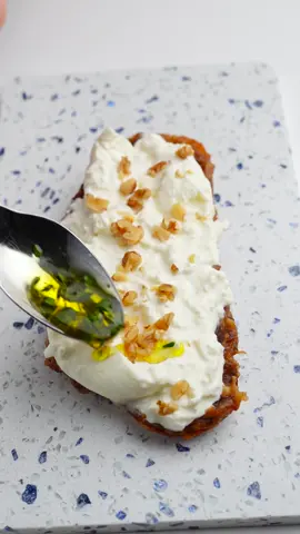 Burrata & Date Toast Ingredients: For the Date Spread: 5 Pitted Medjool Dates 2 tbsp Roasted & Unsalted Walnuts 1 tbsp Maple Syrup (or Honey) 2 tbsp Water (if needed) For the Toast Assembly: 1 slice of your preferred Bread 2 tbsp Date Spread 1 Burrata Cheese A sprinkle of Fresh Thyme About 1 tbsp Roasted Walnuts, chopped A drizzle of Olive Oil A pinch of Salt Instructions: Make the Date Spread: 1. In a food processor, combine the dates, roasted walnuts, and maple syrup. 2. Pulse while gradually adding water, if needed, blending until the mixture forms a smooth paste. If you don't have a food processor, a mortar and pestle can be used instead. Prepare the Toast: 1. Lightly toast the bread slice. 2. Spread a generous amount of the date spread on the toast. 3. Place the burrata cheese on top of the date spread. 4. Sprinkle chopped walnuts on the burrata. 5. In a small bowl, mix thyme with olive oil and a pinch of salt, then drizzle this mixture over the burrata. Serve immediately and enjoy!