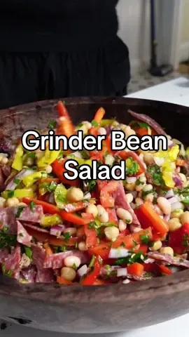 Grinder bean salad recipe - 1 red onion - 2 bell peppers - 1 bunch of flat leaf parsley - 1 can garbanzo beans - 1 can of white beans - 1/2 cup chopped banana peppers - 1/2lb peppered Genoa salami - 1/4 cup red wine vinegar  - 1/2 cup good olive oil  - 2 tsp oregano - Juice of 1 lemon Instructions 1. Dice the red onion, thinly slice the bell peppers and mince the parsley. Chop your banana peppers and thinly slice your salami. 2. Rinse and drain your beans. 3. Add your beans, onion, peppers, parsley, and salami to a bowl. 4. Add the vinegar, olive oil, oregano, and lemon juice. 5. Toss and enjoy! If you eat dairy this is also delicious with some mini mozarella balls.  #mealprep #salad #beans #grinder