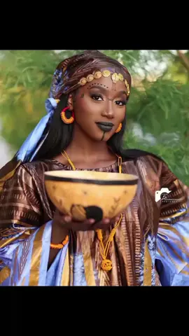 @AwayToAfrica  • Fashion And Style Of The Fulani. Fulani women wear the Mudukare. Mudukare is a sleeveless crop top worn over a wrapper. The amulets are known as Lohol. This amulet beautifies but it also serves as protection. The Fulani women are not shy when it comes to jewelry, they love to adorn themselves with different jewelry pieces. Fulani women love to wear beads around their waist and bracelets on their hands, and jewelry on their heads, noses, earrings, and waist. #TravelAfrica  #diasporacalling #culture #city #luanda #TIA #thisisafrica  #AfricaAwaitsYou ⁠ #soultravel #exploreafrica #IMetGodSheLivesInAfrica #zungueiras   #queensabroad  #afropolitan #fulani  #africanculture #everydayafrica 