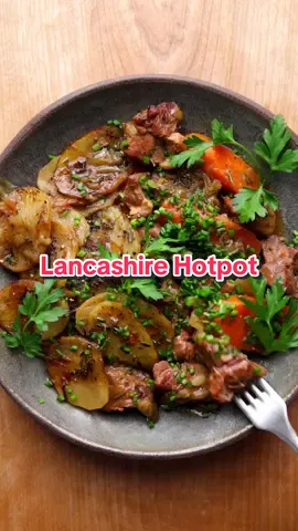 Next Up On Winter Warmers, Meals To Warm Your Bones On Cool Weather Days = Lancashire Hotpot. Rustic, Humble, Northern-England Inspired Happiness. Full Recipe Below! 1 tablespoon grape seed (or neutral) oil 1 tablespoon butter 1 1/4 pounds lamb shoulder, cut into 1/2-inch cubes 2 medium onions, sliced 2 tablespoons minced thyme, divided 1 tablespoon minced rosemary 3 garlic cloves, minced 2 tablespoons flour 2 1/2 cups lamb (or chicken) stock 2 bay leaves 1 tablespoon Worcestershire sauce 3 large carrots, peeled and chopped 1 1/2 pounds Yukon Gold potatoes, peeled and thinly sliced 2 tablespoons melted butter 1/4 cup minced chives Sea salt and cracked black pepper Preheat your Traeger Grill to 325 degrees F. Heat a deep pan over medium-heat, and melt the olive oil and butter together. Season the lamb well with salt, then brown on all sides, about 5 -7 minutes. Remove, add onion, a pinch of salt, 1 tablespoon thyme, rosemary, and cook until softened, about 5 minutes. Add garlic, cook for 30 second, then stir in the flour and coat the onion well. Add stock, bay leaves, Worcestershire, your lamb, a good pinch of salt, then cover and transfer to the grill for 30 minutes. Add carrot, layer on the potatoes starting from the outside of the pan inwards, covering the stew. Brush the potatoes with butter, add cracked black pepper and remaining thyme, cover again, and place back on the grill for 1 hour. Increase the grill temp to 450 degrees F, remove cover, and cook until the potatoes are golden and crisp, and the lamb is fork tender, about 35-45 minutes. Plate up, top with chives, and serve. Delicious! #food #Recipe #EasyRecipe #tiktokchef #recipesoftiktok #foodontiktok #goodfood #foodography #EasyRecipes #comfortfood #stew #lancashire #hotpot #rustic #traeger #traegergrills #traegerrecipes #grilling #EasyRecipe #lamb #potatoes #england #uk 
