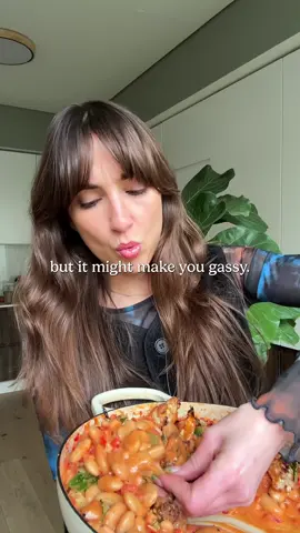 Spicy, Nice-y Harissa Bean Bowl + a fart story 💨  Yes, beans cause gas, but farting is not the enemy. It indicates you’re consuming fibre-rich meals, which the bacteria in your microbiome thrive off. Farting also brings us together through laughter 💚 Here’s some tips to help ease bloating and gas: if you’re new to eating lots of fibrous foods (beans, grains, veggies etc) start small and increase the amount over time, so your microbiome can adjust.  If you’re very sensitive to fibrous foods, rinse your beans instead of adding their canned water like I did here, and use a little stock for the liquid component instead. Eat slowly, chew food well before swallowing  Go for a short gentle walk after your meal  Avoid fizzy drinks  Sip a herbal tea like peppermint or chamomile after eating.   Ingredients: 1/2 a medium head of cauliflower, broken into florets  Olive oil, salt and pepper  1/2 an onion, finely chopped  1 red pepper, finely chopped  1/2 a fresh red chilli, finely chopped 4 cloves garlic, minced  1/2 tbsp smoked paprika  250g cherry tomatoes, halved  700g cooked butterbeans, plus some of the water from their can (if using 400g cans, pour some of the liquid out of the top first) 2 tbsp smokey harissa paste  2 tbsp cream (I used cashew cream)  Squeeze of lemon juice  To serve:  toasted slivered almonds Fresh mint  More cream Pomegranate seeds Method is on my IG page  #fyp #viral #fart #beans 