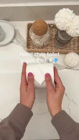 Hotel style toilet paper fold 🧻💎 Take it a step further than a regular triangle fold and make it a diamond shape 💎🧻   #homestaging #homestagingtips #toiletpaperfold #bathroomstyling #hotelhack #hotelstyle #fancy 