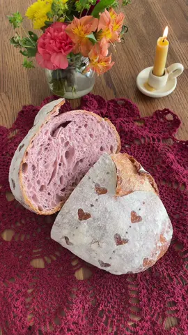 Here she is! My Valentine loaf that I was going for! I love it so much 🥹 💕💞💓 100g starter 360g water 496g Bread Flour ONLY 4g Purple Sweet Potato flour-just a splash basically!  9g salt I may have overproofed mine a little but she still turned out stunning and delicious. Phia liked the pink bread just as much as the purple I previously made.  I love Valentine’s Day so this is the perfect recipe to hear up for it. 🥰 #pinkbread #baking #socute #ValentinesDay #hearts #adorable #bakersofinstagram #breadbosses #sourdough #sourdoughbread #breadart #inspiration #bakinginspo #homesteadlife #candles 