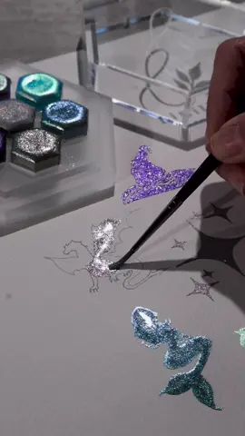 Hey all, Here is a swatch video of our new upcoming set: Once upon a time  Launch will be on next Thursday, 25th at 6 pm (GMT+2, Berlin). The countdown is set up on the main page of lisilinka.com. + Once upon a timet is a set of seven sparkling colors inspired by the fairy tails of our childhood. * Stardust - the center color of the set, a very fine pigmented, pure holographic color that sparkles like a rainbow in direct light. Wizard - our darkest purple so far with an extraordinary sparkle. • Unicorn - a cold magenta shade with holo pigments, which gives this color a beautiful rainbow glitter. *Pixie - a color shifter with fine pigments that shimmer in a light lavender, gold and light mint. Magical like fairy dust. Pegasus - another color shifter with fine pigments that shimmer in a bright blue and gold - Mermaid - a light turquoise blue, reminiscent of the water in a calm lagoon.      * Dragon - a light greyish mint that - once activated - has a subtle shimmer of pink glitter, creating a mystical effect of dragon scales.  #art #artist #artwork #artistsoninstagram #drawing #draw #painting #watercolor #watercolorpainting #watercolorartist #watercolorartwork #geschenkidee #aquarelle #illustration #illustrationartists #illustratorsoninstagram #watercolorart #aquarellepainting #aquarelle #sparkle #aquarellepainting #holo #holographic #selfmade # #handmade #rainbow #metallics #metallicwatercolors #metallicwatercolor