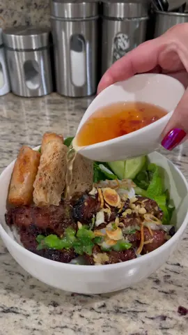 BÚN THỊT NƯỚNG CHẢ GIÒ GRILLED PORK & FRIED SPRING ROLLS VERMICELLI NOODLE BOWL  Simple but delicious 😋  Marinade the meat with 1 cup of my all purpose marinate. Recipe pinned on the reels section. If you don’t have it. Here’s one from scratch  Recipe: • 2-3 lbs skinless pork (sliced thin) • 1/4cup fish sauce (3 crabs 🦀) • 3 tablespoon light soy sauce  • 2 tablespoon minced garlic  • 1/4 cup chopped green onion (optional) • 1/4 cup finely chopped lemon grass (more if prefer) • 2 tablespoon cooking oil  • 3 tablespoon sugar  • 2 tablespoon honey  • 1 teaspoon msg (optional) • 1 teaspoon ground pepper  Mix well until sugar dissolved. Marinate for 2-3 hrs. or overnight in the refrigerator. Skews the meat, preheat the grill and let start grilling. Enjoy 😊 Scroll back a few post for the dipping sauce.    😉#nuocmamafoods #vietnamesefood #grilledmeat #grilledmeats #grilledpork #grillpork #grilledporkbelly #meatskewers #skewers #vietnamesecuisine #porkbelly #bbqlife #bbqlovers #fishsauce #nuocmam #nuoccham #recipes #f52grams #vietfood #vietfoods  #phoga #bunbo #recipes #bunbohue #bunrieu #miquang #bunthitnuong #Vietnamesefoods #hutieu #phobo #banhxeo