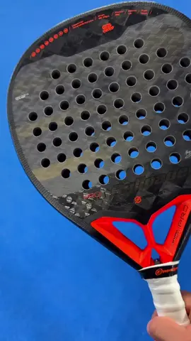 The Bullpadel HACK 03 Hybrid 2024 is a racket that combines power and control with a medium-hard feel. It has a hybrid shape, a carbon frame, a TriCarbon surface, and a MultiEVA core that provide a large sweet spot and a high balance. It also has the Air React Channel system that improves the maneuverability and the aerodynamics of the racket. The Bullpadel HACK 03 Hybrid 2024 is the perfect choice for professional or advanced players who want to excel in every aspect of the game.  Get it from The Padelverse, the online store with the fastest shipping and the best prices in the United States. Order yours today and take your game to the next level!