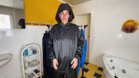 Nadine with her long hair in her shiny nylon jacket. For more videos like and follow! #shinyclothing #longhair #rainwear #shinynylon #glanznylon #shinycouture #shiny 