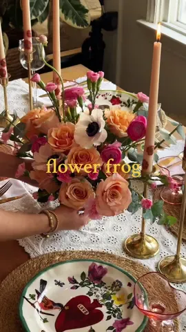 flower frogs are the best for tablescapes where you don’t want your blooms to block people’s faces 🌸 these pretty flowers from @UrbanStems made for the perfect galentine’s arrangment 💕 #flowerfrog #galentinesday #flowerarrangement #brunchideas #galentinesparty #floralarrangements #galentine #tablescape 