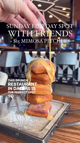 This Brunch spot has $15 mimosa pitchers and it’s the perfect spot to take friends for a Sunday Funday 🥂 you need @STIRR ✨ Stirr is a popular restaurant in Deep Ellum & Addison that gives all the VIBES for Sunday Funday. The Dallas location has a rooftop bar with downtown city views, bottle service and Live DJ starting at 3pm. But this is one of my favorite spots for brunch they have $15 mimosa pitchers and have a FULL BOTTLE of champagne in them! Plus the other brunch cocktails are only $6. But obviously it’s not brunch without food. Pictured is their Donut Tower with cinnamon sugar donuts with Nutella dipping sauce 👏🏼 plus the Biscuit Breakfast Sammy, a giant biscuit topped with bacon, fried chicken, eggs, and all the breakfast toppings 😍 but my personal favorite is the Gorgonzola Waffle Fries 🍟 If you love Blue Cheese like I do, you will love these ♥️ I’m never disappointed with food here, and the vibes and staff are always on point. Brunch starts by 11am at each location but the DJ starts 1pm in Addison and 3pm in Dallas. Plus both the Deep Ellum & Addison locations are in walkable area with a bunch of brunch party options, so you can make it an all day Sunday Funday 🥳 Be sure to check them out! 📍Dallas 