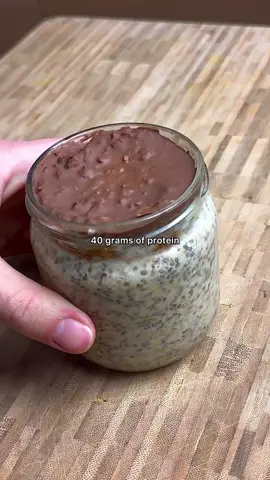 High protein & good for your gut overnight chia oats 💪  Perfect for mornings after exercise 🏃‍♂️ Ingredients: - 1/2 cup oats - 1/4 cup chia seeds - 2 scoops protein powder (30g actual protein target) - 1 tsp flaxseed meal - 2 Tbsp peanut butter  - 1/2 cup milk, water or a mix (depending on how runny you like it - add more) Toppings:  - 2 Tbsp chocolate to 1/2 tsp coconut oil microwaved until runny together  - Pumpkin seeds (pepita) - Coconut flakes - Goji berries (I ran out lol) Method: 1. Add oats, chia, protein, liquid of choice and mix until a thick but smooth consistency 2. Add peanut butter and submerge inside (so it’s all hard the next day) 3. Add flaxseed meal on top for a bit of texture 4. Add seeds and other things you like on top 5. Add chocolate melted on top  6. Fridge overnight for best result as chocolate & peanut butter are hard and good texture  7. Enjoy and recover well! #Running #marathon #highprotein #oatmeal 
