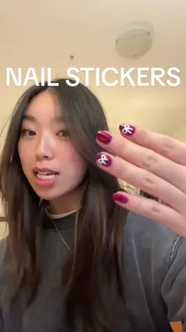 yall NEED nail stickers, they make my basic nails look so much cuter🤍🎀 #nailstickers #athomenails #rednailtheory #nailbows 