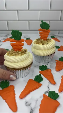Carrot cupcakes 🥕🧁🥕🧁 Carrot cupcakes topped with a huge swirl of cream cheese frosting, filled with chopped walnuts and topped off with a chocolate carrot Absolutely delicious 😋 🥕🐰 The carrots are made using white chocolate coloured with orange and green. I always use @colourmill oil based colours. #cupcakes #carrotcake #cakedecorating #cakedesign #easterbaking #getcaked 