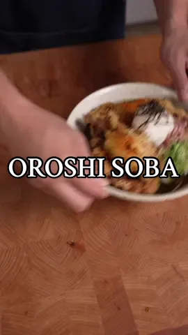 Oroshi Soba 🇯🇵🍜 Had a similar soba to this in my travel to Echizen, Fukui in Japan! The grated radish adds a nice refreshing flavor to the soba and I decided to add soft shell crab tempura for crunch as well 🦀🍤 INGREDIENTS Noodles: - Soba noodles (buckwheat noodles) Soba sauce: - onion leeks - kombu kelp - shiitake mushrooms - sake - soy sauce - mirin - sugar - dashi powder - water Tempura: - Soft shell crab - Tempura flour - Plain flour - Egg - Vodka - Water Other toppings: - Bonito flakes - Grated radish  - Onion leeks, sliced INSTRUCTIONS: - Make soba sauce by combining all ingredients listed under “soba sauce” in a saucepan/pot. Add enough water so it’s more like a broth. Let simmer for about 20mins, strain and set aside. - Make soft shell crab tempura by combining tempura flour, egg, vodka and water. Coat crab in plain flour, dip in wet batter and fry at 165C for 10-15 mins or until golden and crispy. Make sure to drizzle over tempura batter while frying to get crispy bits. - Boil soba noodles according to package directions. - Top with sliced leeks, grated radish, bonito flakes and your tempura crabs. Add your sauce, serve and enjoy!! #japanesefood #cookingasmr #asmr