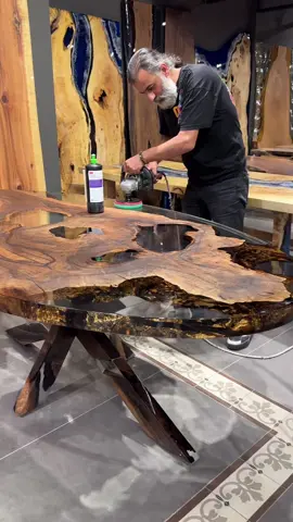 “Traces of the Past, in the Light of the Future: Unique Epoxy Table Made of 400-Year-Old Walnut Tree. (@by_yesildesign) This unique table is a masterpiece of history. The spirit of the walnut tree, which has grown in its birth house for 400 years, came to life by combining with the touch of modern design. Old and new, natural and artistic, past and future… all in every line, every touch of this table. Epoxy fillers crack the natural defects of the tree and the cracks of its age, creating a monument to the past. This table is not only a piece of furniture, but also a work of art that carries glorious memories of the past. #epoxyresintable #epoxyresinart #epoxy #resin #woodresintable #epoxywood 