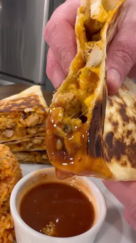 Easy Chicken & Cheese Taco Bell Style Quesadillas are an easy dinner that won’t disappoint!  INGREDIENTS  1 lb chicken breast  2 TBSP of butter  1/2 tsp salt and pepper  1/4 tsp cayenne 2 tsp chili powder 1 tsp each of cumin, paprika, and dried cilantro Extra Grande burrito size flour tortillas  Shredded cheddar cheese Taco Bell Creamy Chipotle sauce  INSTRUCTIONS  Cut chicken up into small pieces. Add 2 TBSP of butter to a skillet over medium high heat.  Season with salt, cayenne, chili powder, cumin, paprika, dried cilantro, and black pepper (you could also just use a taco seasoning packet instead of these seasonings if you prefer that). Cook chicken until it reaches an internal temp of 165 degrees.  Remove the chicken from the skillet and turn the heat down to medium.  Lay out the tortillas and top with shredded cheese, chicken, and the Taco Bell sauce. Fold tortillas in half and cook until both sides are golden brown and crispy.  Enjoy! These are good with sour cream and taco sauce.  #dinner #recipes #mealideas #chickenrecipes #EasyRecipes #quesadillas 