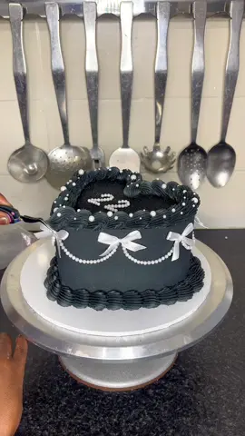 Replying to @Itunuoluwa Akinsika Here is cake number 2! Which do you prefer? ✨  . . . #KutiwaCakes #cake #caketok #caketiktok #cakedecorating #cakedecorator #cakedesign #cakevideo #cakeinspo #manchestercakes #heartcake #blackbuttercream #bows #cottagecore  
