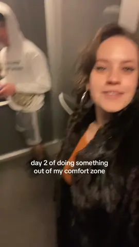 just a nice girl filming a video in an elevator 