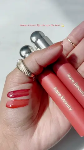 @Selena Gomez In love with these @Rare Beauty lip oils in shade Joy and Serenity ❤️ This tinted lip oil treats lips to the most comfortable, buildable kiss of color and shine. Lips stay smooth, hydrated, and nourished all day while looking fuller and healthier. Never sticky! Apply one swipe for a slick wash of color or layer for a bold, juicy pop ❤️ This can be purchased from @Sephora UK where you can use doscount code noorjsph for money off and @SPACE NK ❤️ #texture#unboxing#prep#pigmented#Love#review#new#explorepage#viral#viralreel#viralproduct#satisfyingvideos#satisfying#trendy #Lifestyle #trendingnow#shine#rarebeauty#lipoil#joy#viralvideo#content#fyp#gold#selenagomez#selena#rareaesthetic#foryou#fy#foryoupage#foryourpage#sephora#makeup#lips#makeuptutorial#makeuptiktok#oil  