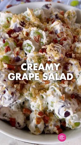 Creamy Grape Salad is a sweet and sour combination with bright green and purple grapes frosted with silky smooth sour cream and topped with a crunchy pecan. Just imagine big, juicy crisp grapes surrounded by a creamy goodness. #therecipecritic #salads #grapesalad #EasyRecipe #recipeideas #recipeforyou