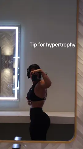 Tempo for hypertrophy  Key for hypertrophy. SLOW AND CONTROLLED REPS. And I know I’ve said this a million times before but let’s break it down  Tempo is basically how fast you perform each part of the exercise  The reason why this is so important for hypertrophy is because a more controlled tempo will increase the time under tension and the higher the muscle tension the more growth you get. This is because muscle tension is what leads to muscle breakdown, muscle damage stimulates growth hormone production which leads to greater muscle growth  So while faster lifts are ideal for strength training, slow lifts are ideal for hypertrophy  So what would be a good tempo for hypertrophy? 3:1:3:1  Tempo is written as 👇🏽 Eccentric count : isometric hold count : concentric count : isometric hold count  Being the eccentric the part in which the muscle fibers get lengthened (ex: in hip thrust would be lowering the weights)  The isometric would be the hold at the bottom and top of the movement  And the concentric the part in which your muscle fibers shorten (lifting the weight)  The thing is to work not only hard but smart as well, you can get more gains from doing less and slow and controlled reps than doing a bunch of explosive reps Wearing @DFYNE  #CapCut #gymgirl #gym #Fitness #GymTok #glutesworkout 