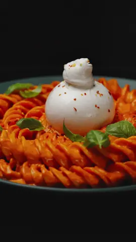 Roasted Red Pepper Pasta🌶️ The editing stream of this video is already available to all members of the “Art Factory” course. Join us and learn how to make creative videos. Link in bio.✅  ❂ Ingredients: 4 Fresh Red Bell Peppers 2  Shallot onion 1  a Head of garlic Olive oil 1 cup Heavy Cream  Red Chili Flakes  Dry Italian seasoning  Salt/Pepper to taste 1 Tbsp Tomato paste  1 Tbsp Butter 400g. Giant Fusilli Pasta ❂ Cooking Process:  ⁃ Prepare the Roasted Red Peppers: Cut the peppers and onions into slices, cut off the top of the garlic and place in a baking dish, pour in oil and sprinkle with seasonings. Bake in the oven for about 1 hour until done (350 F).  ⁃ Cook the Pasta: Boil the pasta in salted water until al dente, reserving some pasta water for later.  ⁃ Make the Sauce: Transfer the prepared baked peppers with onions and garlic to a blender, add cream and a little pasta water, beat until smooth.  ⁃ Combine: In a heated braiser, melt the butter and mix with tomato paste, adding a little water from the paste, then pour in the sauce. Mix the cooked pasta with the creamy roasted red pepper sauce, adjusting the consistency with reserved pasta water as needed.  ⁃ Serve: Garnish with fresh basil and additional burrata cheese before serving. Enjoy ❤️ #pasta #italianfood #italian #pastalovers #roastedpeppers #peppers #bellpeppers #food #foodporn #Foodie #foodart #foodblogger #cooking #cookingart #EasyRecipe #Recipe #foodvideography #videography #videographycourse