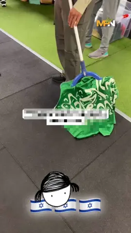 An “Israeli” military official uses the flag of Saudi Arabia as a mop to clean the floor. The Arabic written on the flag is the Islamic declaration of faith, commonly known as the #shahada.
