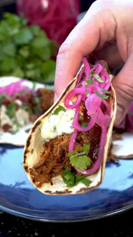 #ad Leftover Easter Lamb Tacos cooked with the @Ninja Kitchen UK Ceramic Cookware Range  This is a great dish to make use of the leftover lamb from Easter Sunday, made with the Ninja ceramic range which is a long-lasting non-stick performance cookware range. Made with a dual-bonded ceramic coating, it helps you enjoy healthier meals using little to no oil, makes your life so much easier to cook and clean up! Ingredients:  Harissa Lamb:  500g Leftover Lamb 2-3 tbsp Harissa Paste  100ml water  Raita:  1 cup Yogurt  1/2 cup Cucumber  2 tbsp Coriander  1 Chilli  1 tsp Cumin  1/2 Salt  Harissa vinaigrette:  2 tbsp Harissa paste  1/2 cup White wine vinegar  2 tbsp Honey  Pickled red onion:  1/2 cup white vinegar  1/2 cup water  1 Red onions  1 tsp Mustard seeds 1 tsp Coriander seeds  1 tsp Peppercorns  Method:  Pickled Onion: - Finely slice your onions and place them in a heat proof container. - In a pan, combine all the ingredients, bring to a boil, and pour over the onions. - Cover with a lid and set aside until ready to serve.  Raita: - Grate the cucumber and drain excess juice. - Finely chop the chilli and coriander, and add them to a bowl along with salt and cumin. Mix well. - Refrigerate until ready to serve.  Harissa Vinaigrette: - Heat the Harissa in a pan for a minute. - Add vinegar and honey, stir well, and set aside until ready to serve. Lamb: - Separate the lamb into strands using your hands or a fork. - Mix in the harissa and cook in a pan for a minute. - Add water and remove from heat.  Assembly: - Toast tortillas in a separate pan. - Build your taco in the following order: tortilla, lamb, raita, harissa vinaigrette, pickled onion. - Garnish with coriander before serving. Enjoy!  #NinjaCeramic 